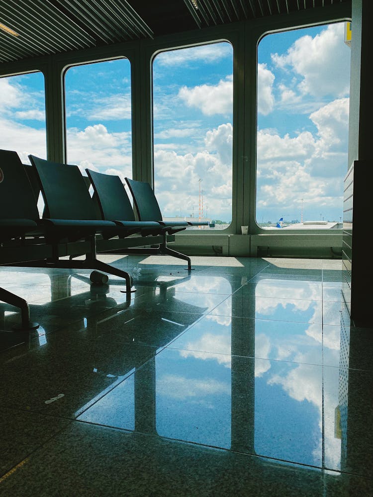 Empty Waiting Room Of Modern Airport With Large Windows