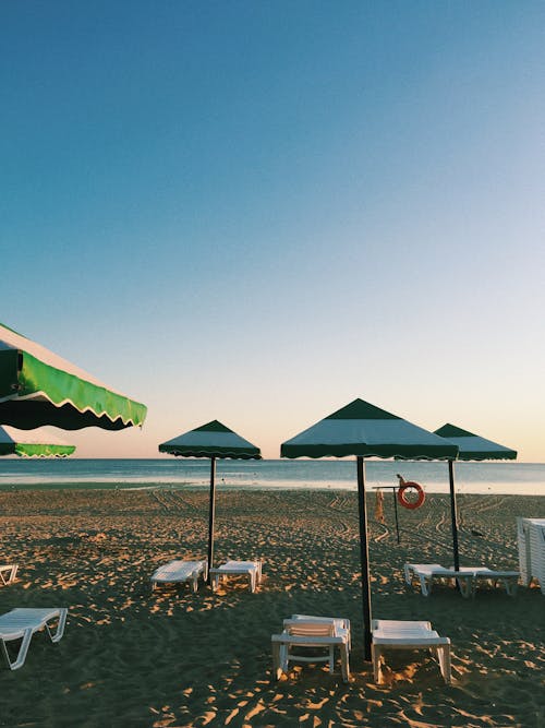 Beach Umbrellas Near Body of Water