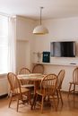 Black Flat Screen Tv Mounted on White Wall
