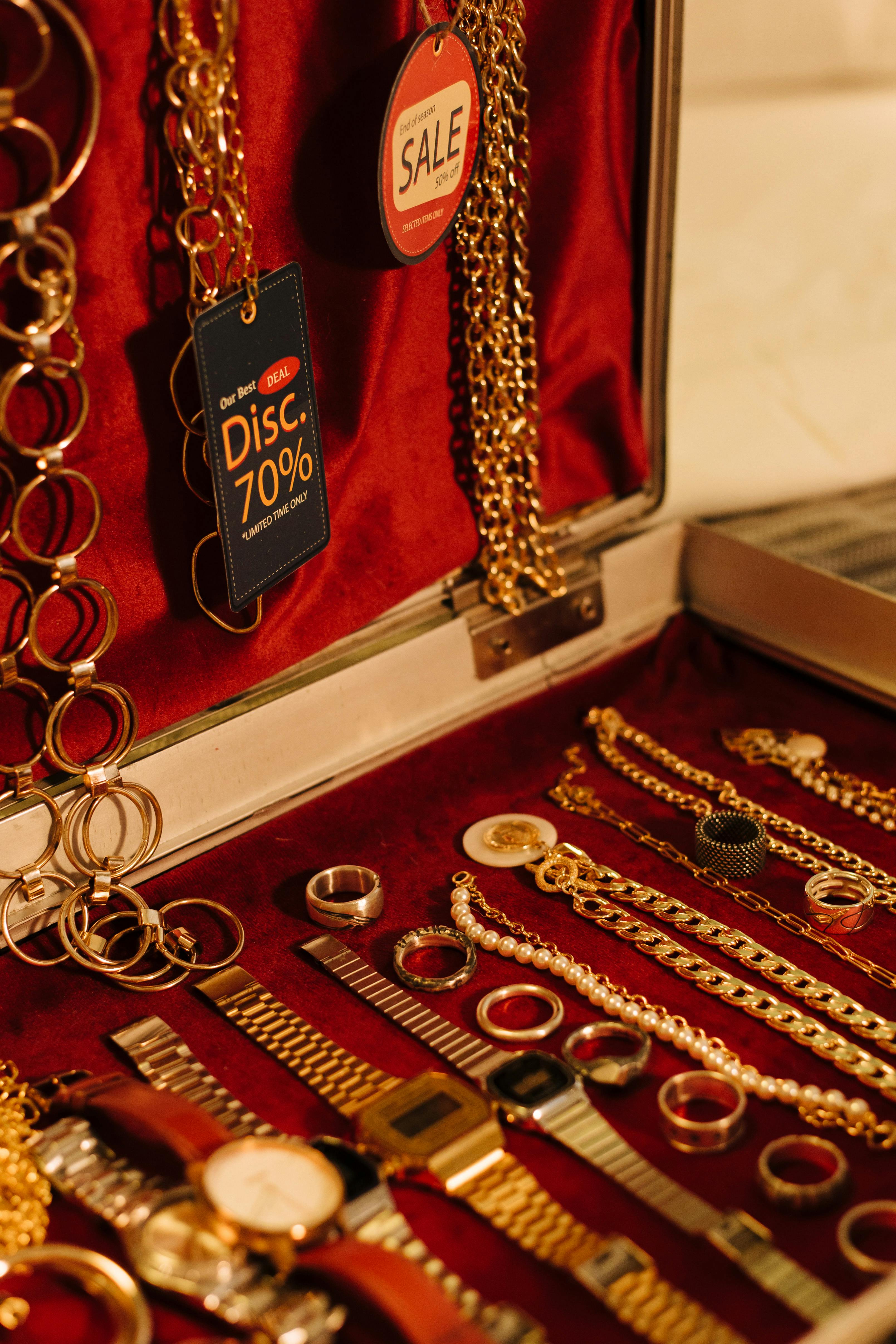 gold bracelets on red textile