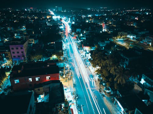 Free stock photo of asphalt road, blue background, bright lights