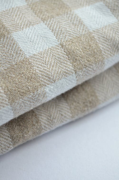 A Close-Up Shot of Folded Beige Cloth