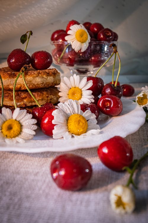 Brown Bread With White Daisies on White Ceramic Plate