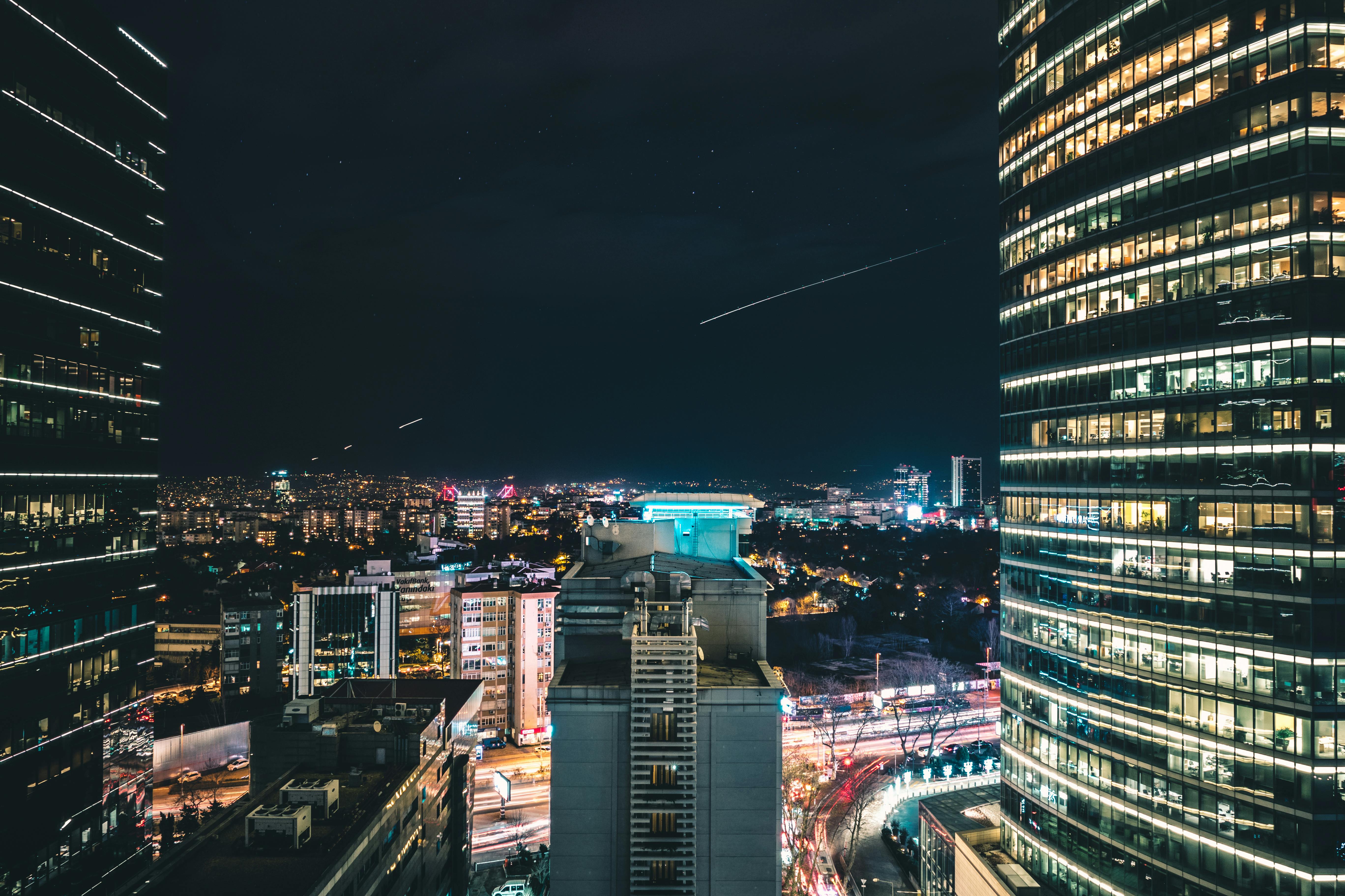 High Rise City Building during Night Time Photo · Free Stock Photo