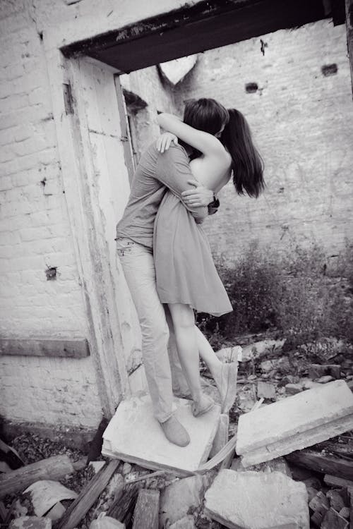 Free 

A Grayscale of a Couple Hugging Each Other Stock Photo