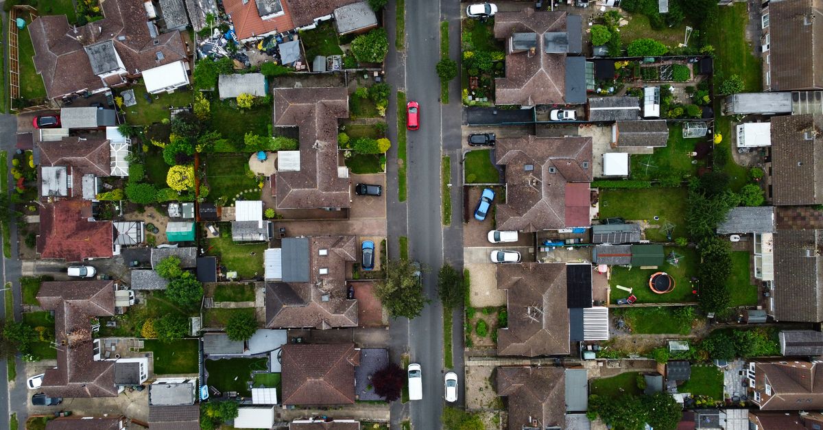 Drone shot capturing the houses and streets in a suburban area of Luton, England.
