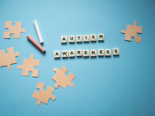 Free Scrabble Tiles of Autism Awareness on the Table Stock Photo