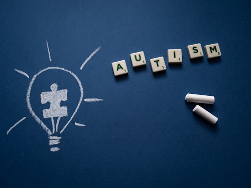 Scrabble Tiles and Chalk on Blue Background