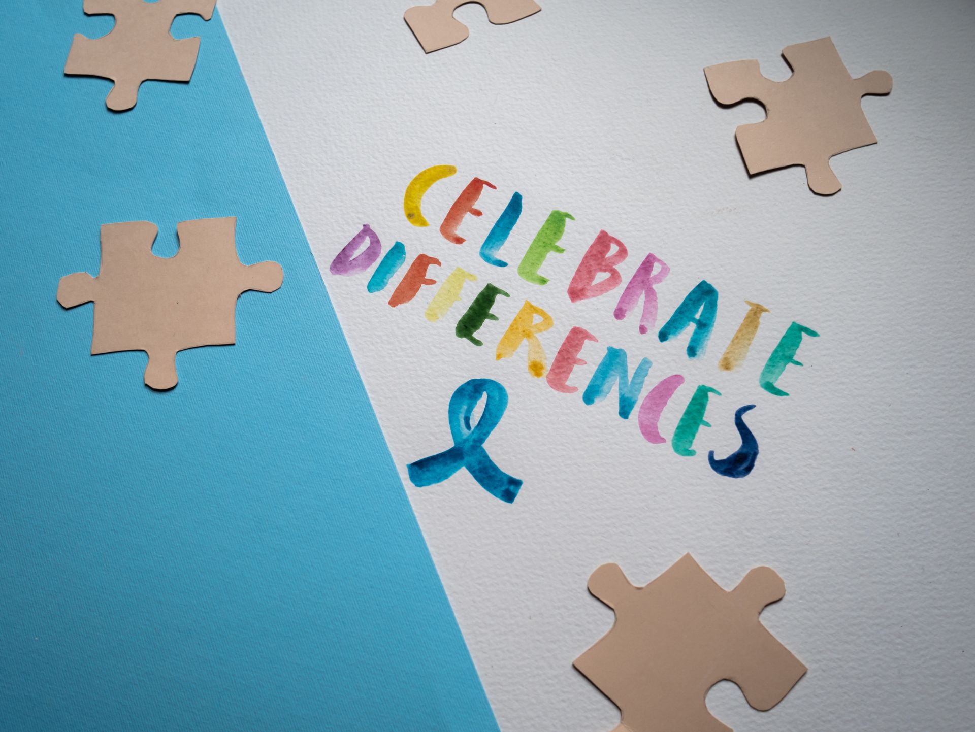 A Slogan Celebrate Differences on a White and Blue Surface