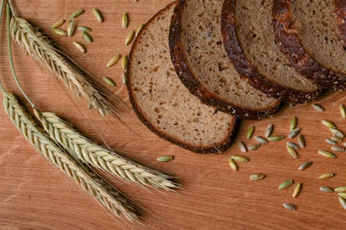 Free Sliced Bread on Brown Wooden Tray Stock Photo