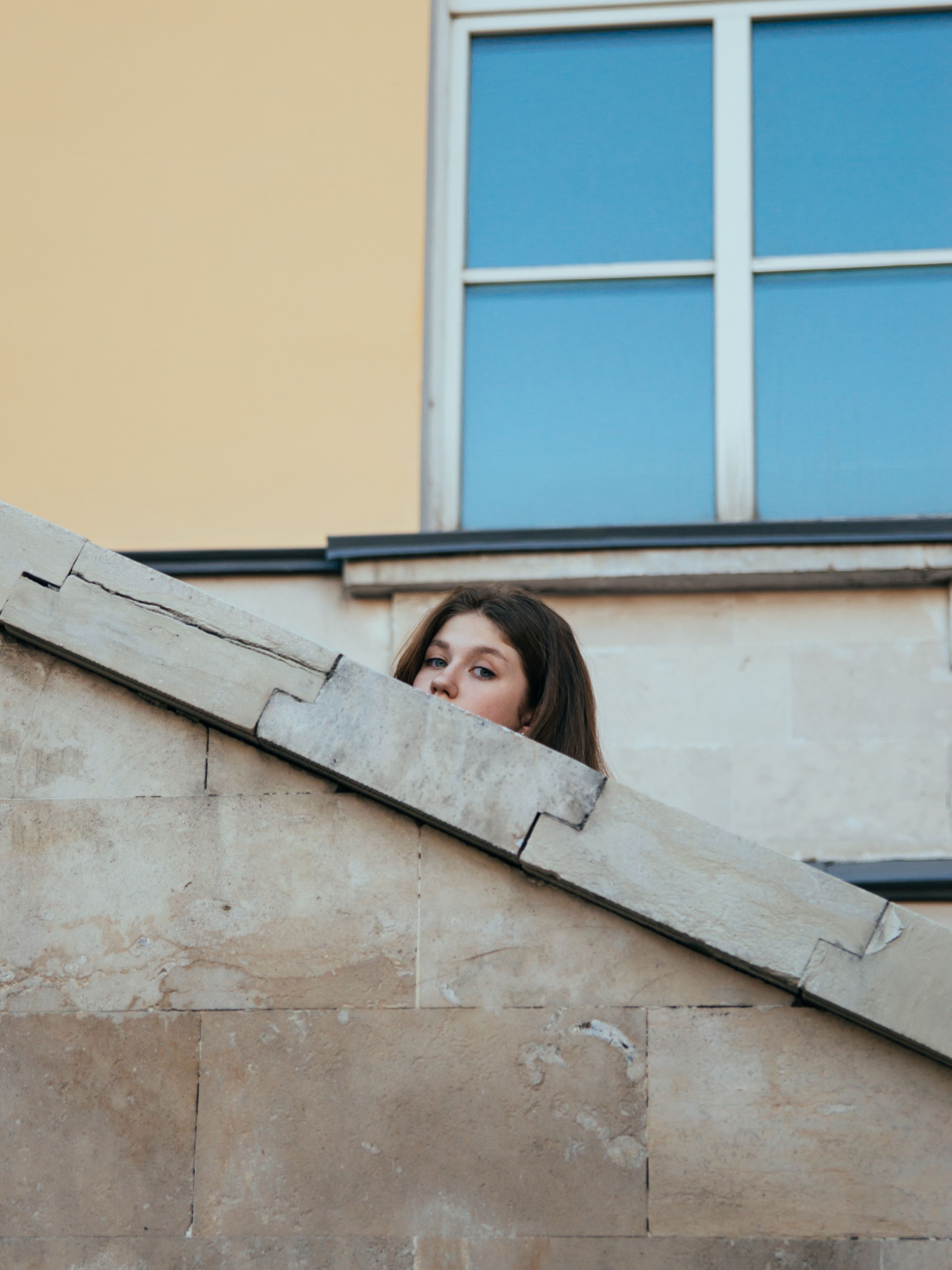 Woman Looking Over the Concrete Railing · Free Stock Photo