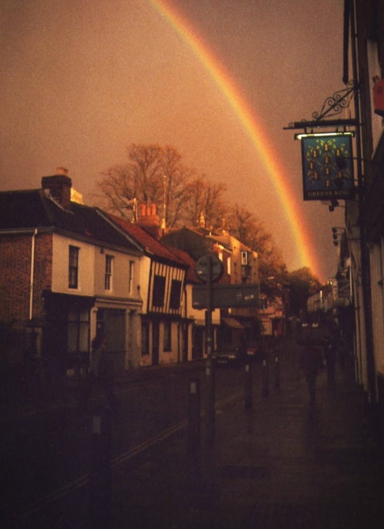 A Rainbow After The Rain Across A Dark Sky