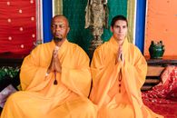 Men Meditating in Front of the Altar