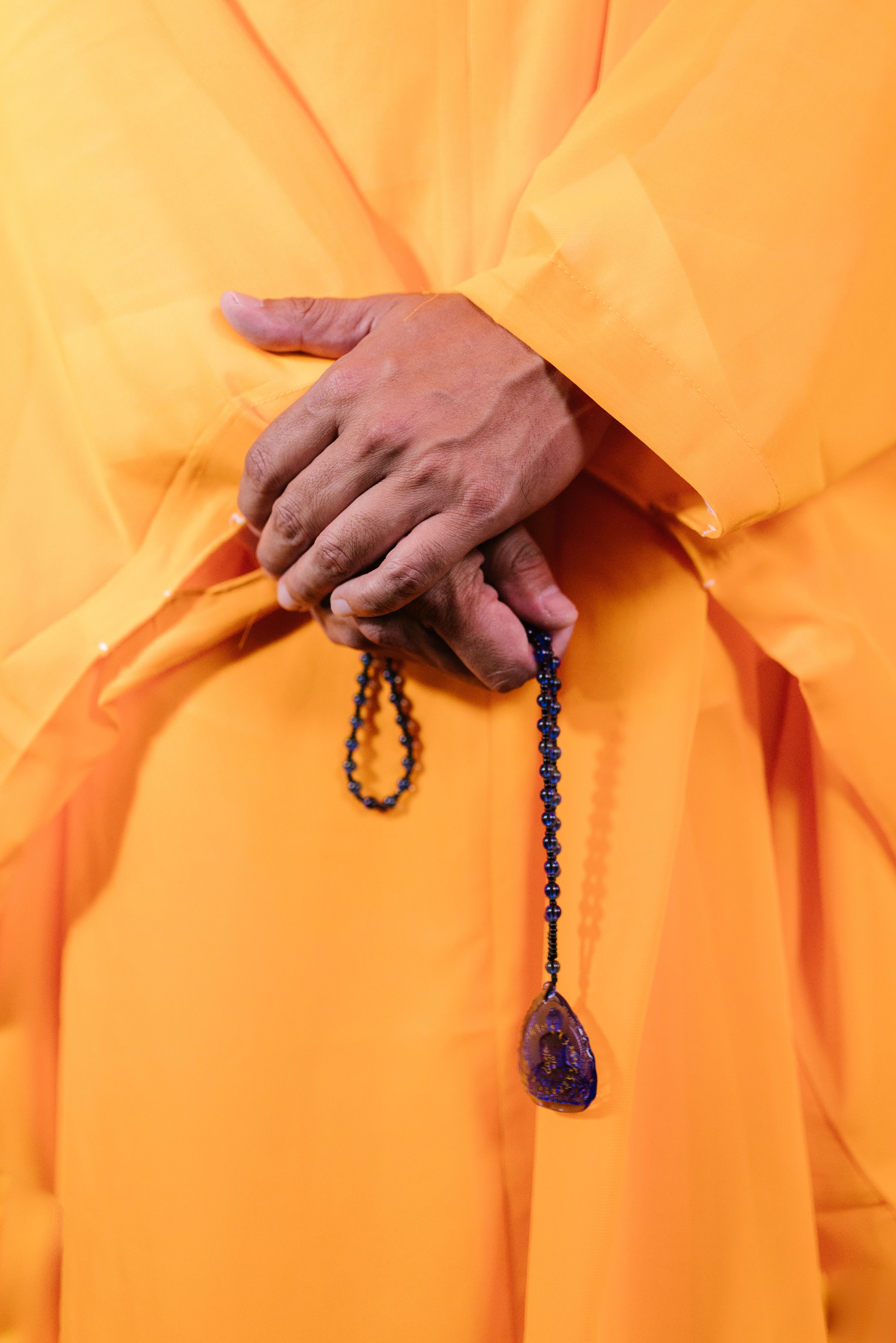 Close-Up Shot of a Person Holding Prayer Beads · Free Stock Photo