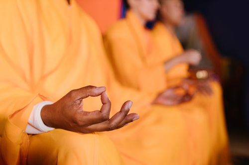 Free Monks in robes practicing meditation, focusing on inner peace and mindfulness. Stock Photo