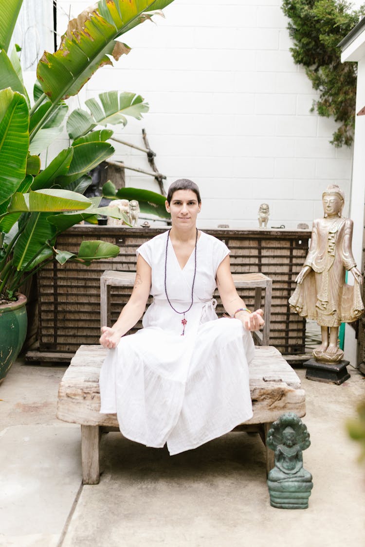 A Buddhist Praying In The Garden