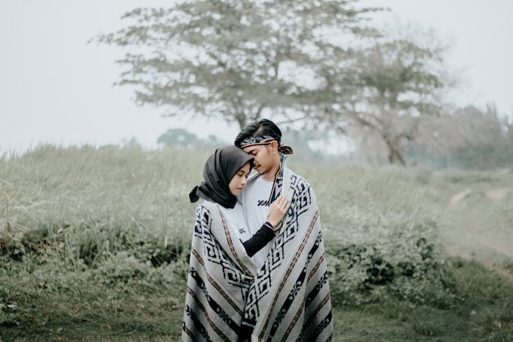 Couple Wrapped In Scarf