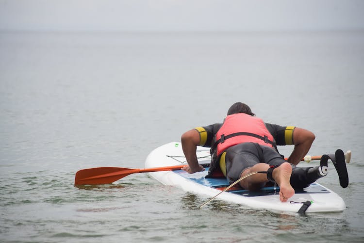 A Man Practicing Standup Paddleboarding