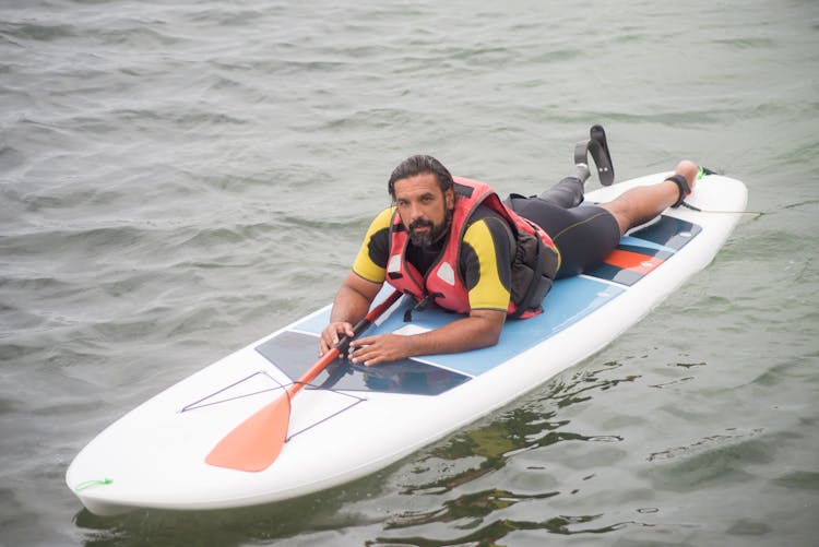 A Man Practicing Standup Paddleboarding