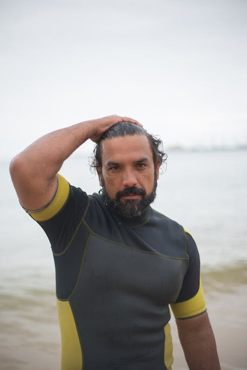 A Man in Yellow and Black Wetsuit