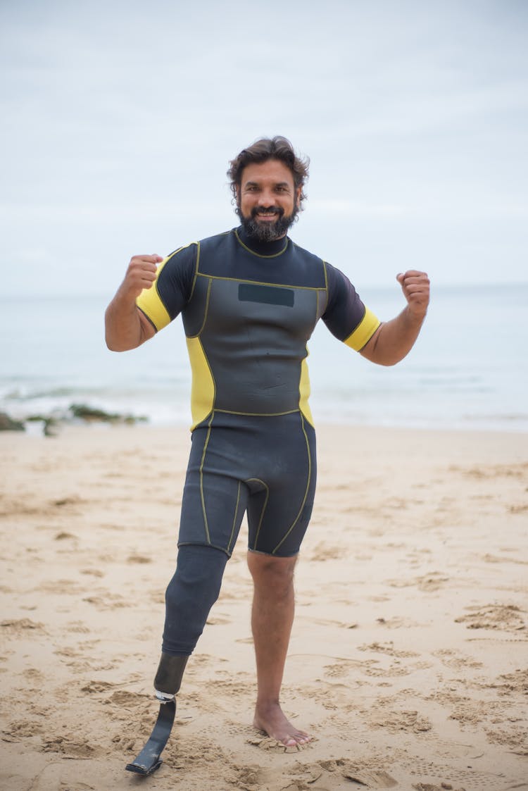 A Man Wearing Swimwear Standing On Shore