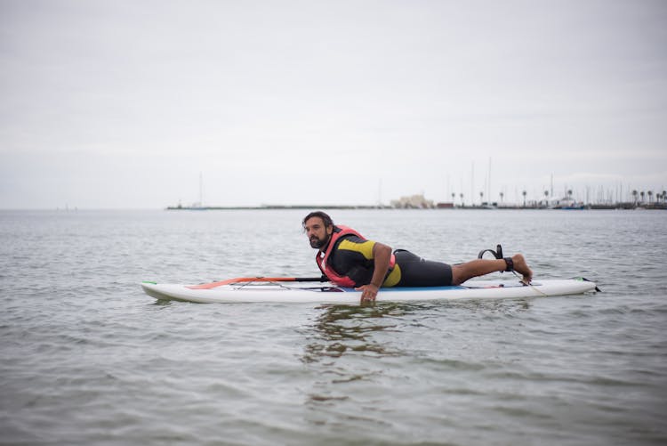 A Man Practicing Standup Paddleboarding