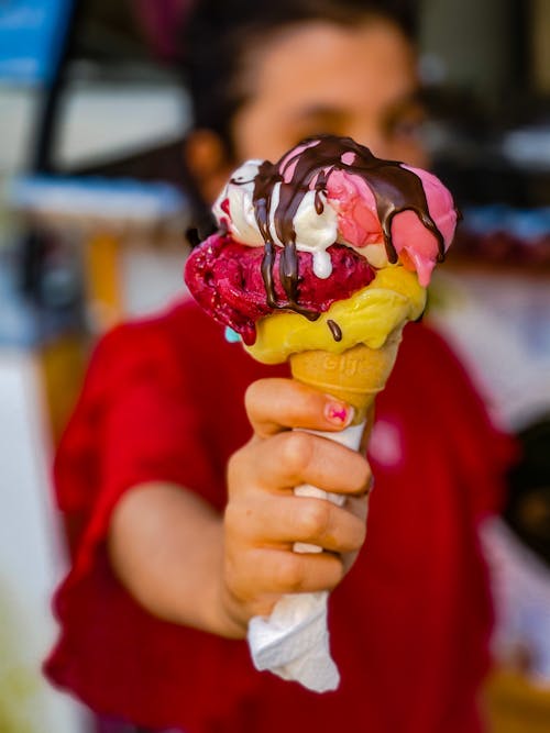 A Person Holding Ice Cream on Cone
