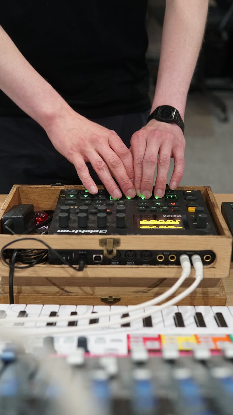 Man Mixing Music On A Console 