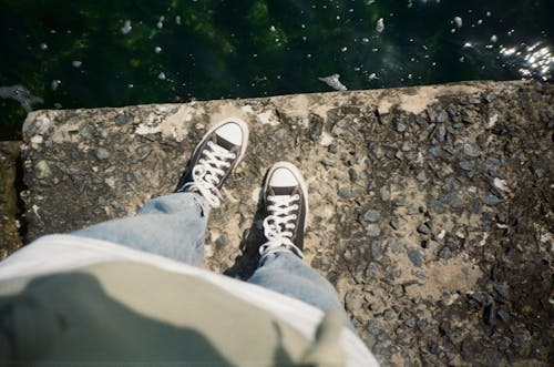 A Person Standing on The Concrete Edge