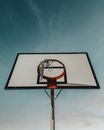 Black and White Basketball Hoop Under Blue Sky