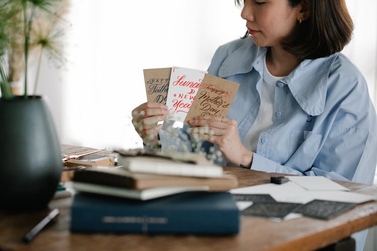 Woman Holding Selection Of Handmade Cards