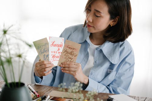 A Woman Flashing Her Handmade Greeting Cards
