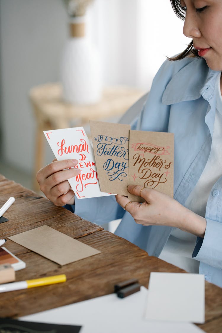 A Woman Holding Greeting Cards