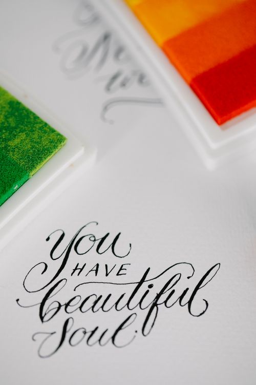 Free Beautiful calligraphy text with vibrant color swatches creating an inspiring artistic scene. Stock Photo