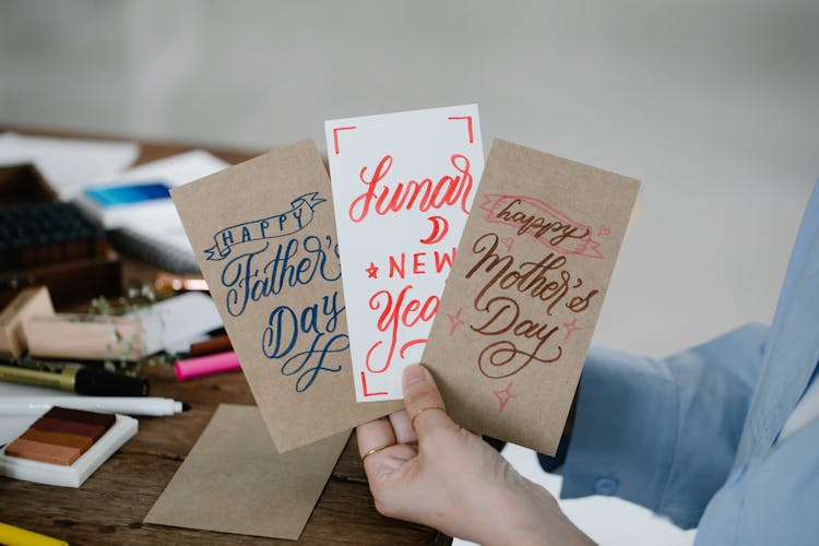 A Person Holding Greeting Cards