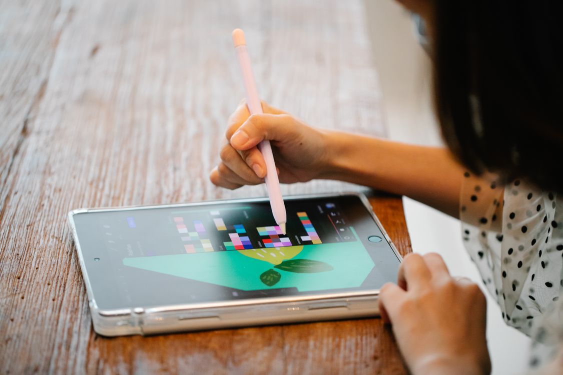 Person Using a Tablet · Free Stock Photo