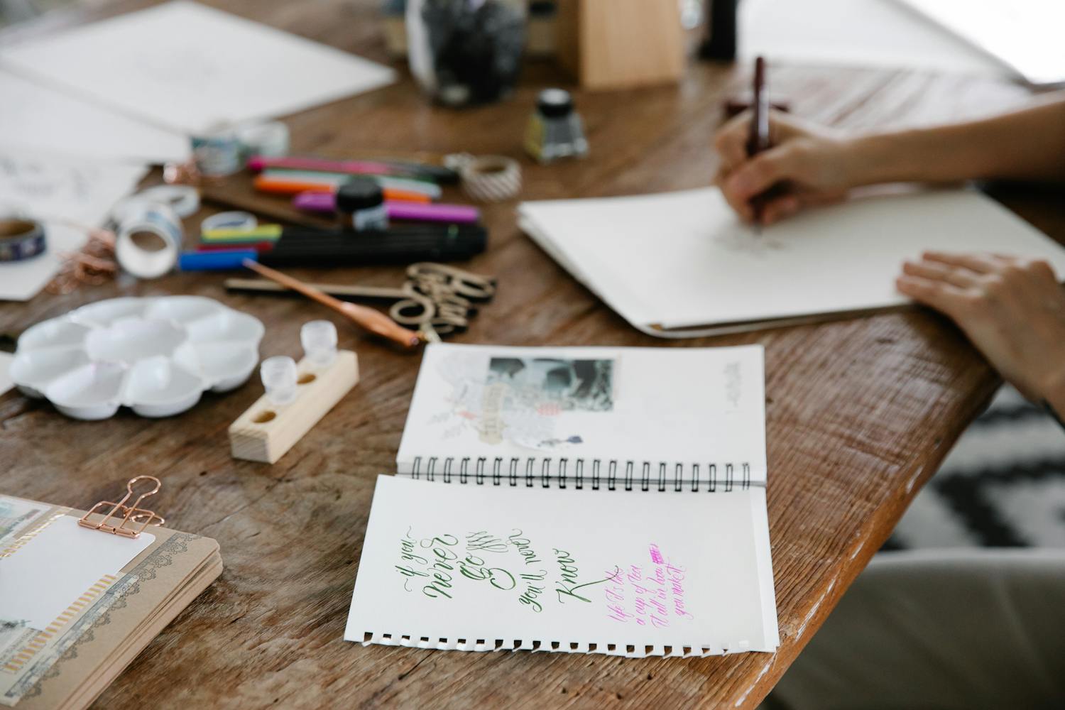 Artistic workspace showcasing handcrafted eyewear sketches and natural materials