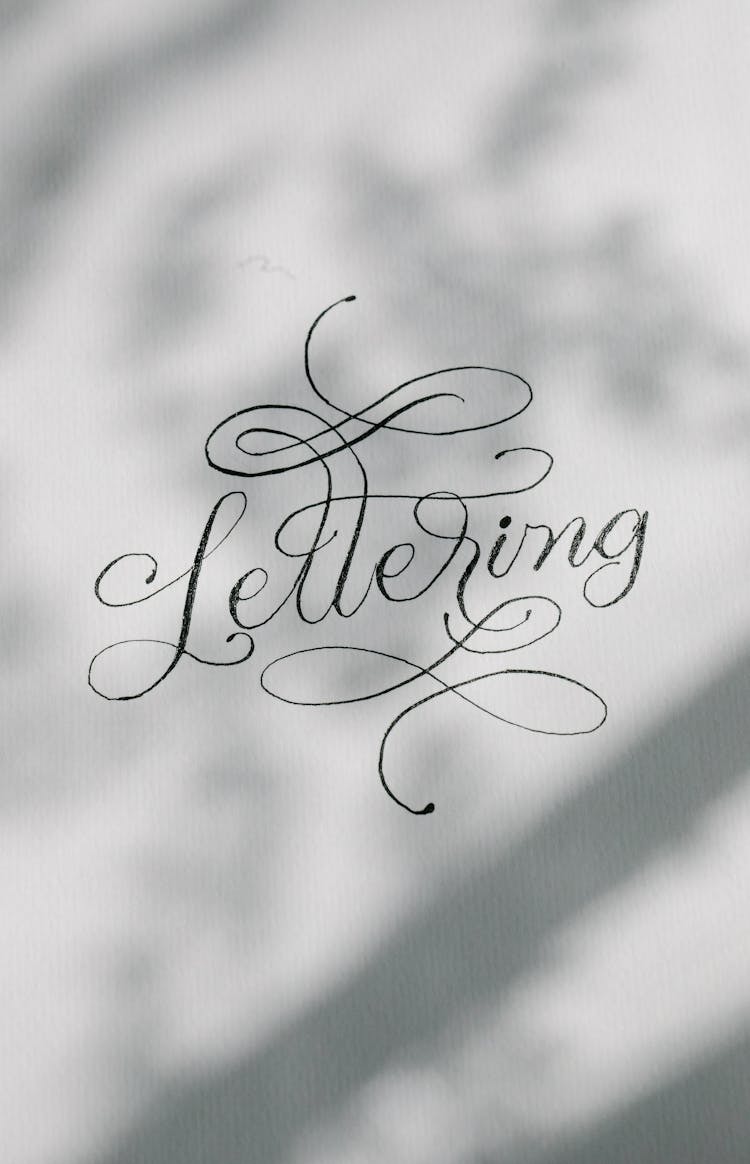 Cursive Text On White Paper