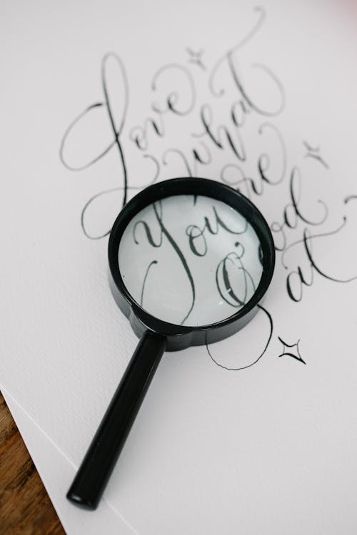 Magnifying Glass over a White Paper