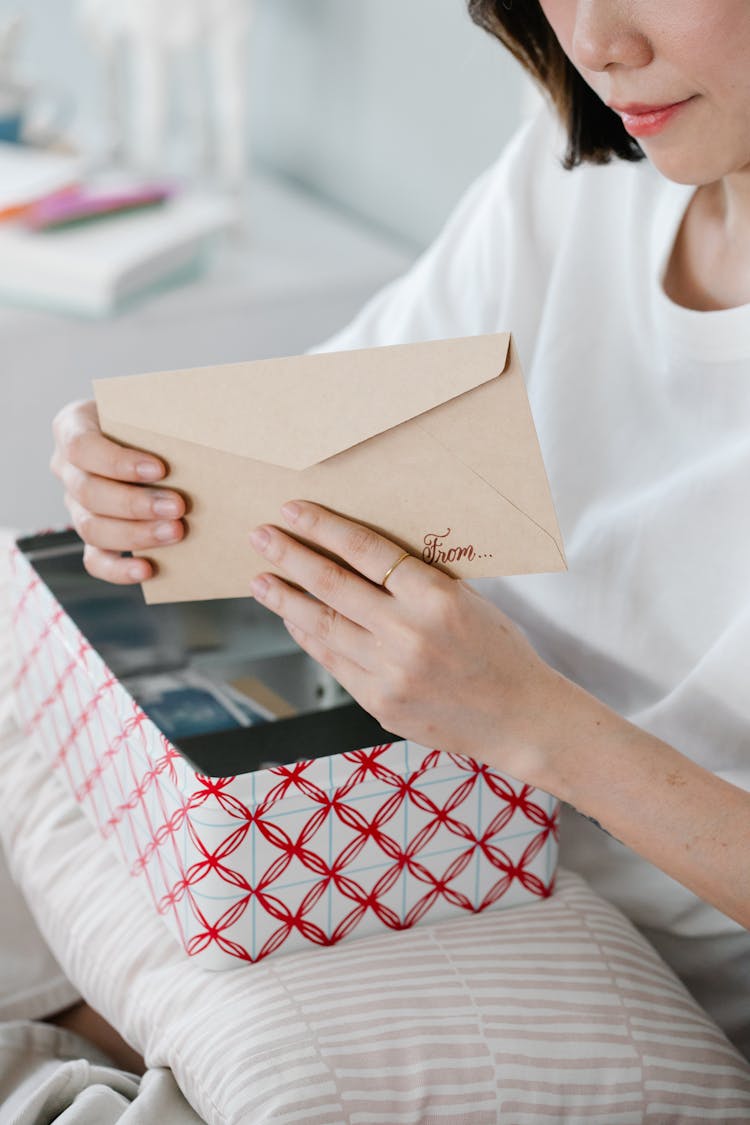 Woman Holding An Envelope