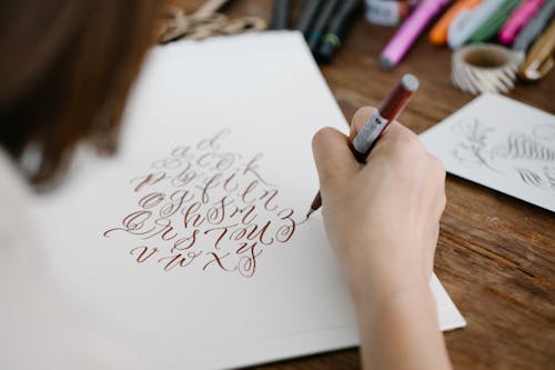 Close-Up Shot of Person Writing on Paper