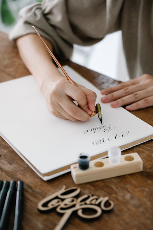 Close-Up Shot of Person Writing on Paper