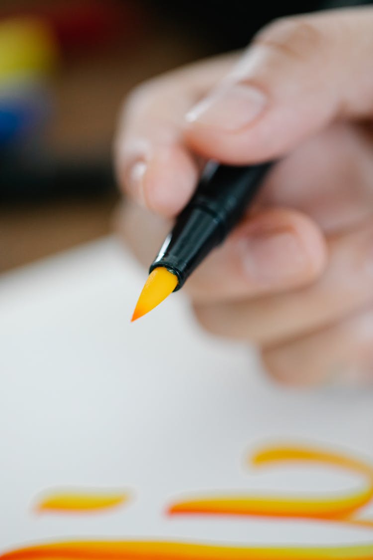 Close-Up Shot Of Tip Of Yellow-Orange Coloring Pen