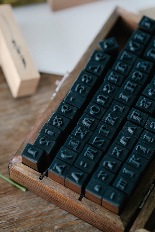 Free Alphabet Stamps on a Wooden Case Stock Photo