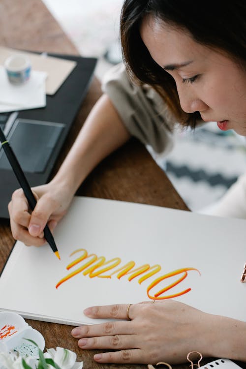 Woman Writing on Paper