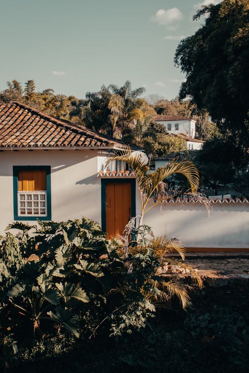 Free A picturesque colonial house in Tiradentes, Brazil, surrounded by lush vegetation. Stock Photo