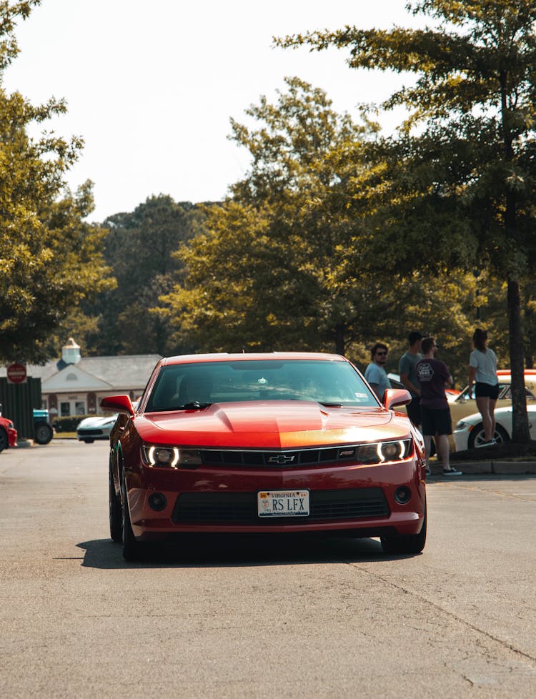 Red Chevrolet Camaro On Car Park