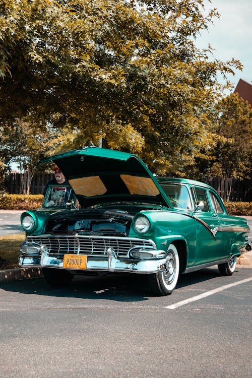 Green Classic Car Parked Near Green Trees