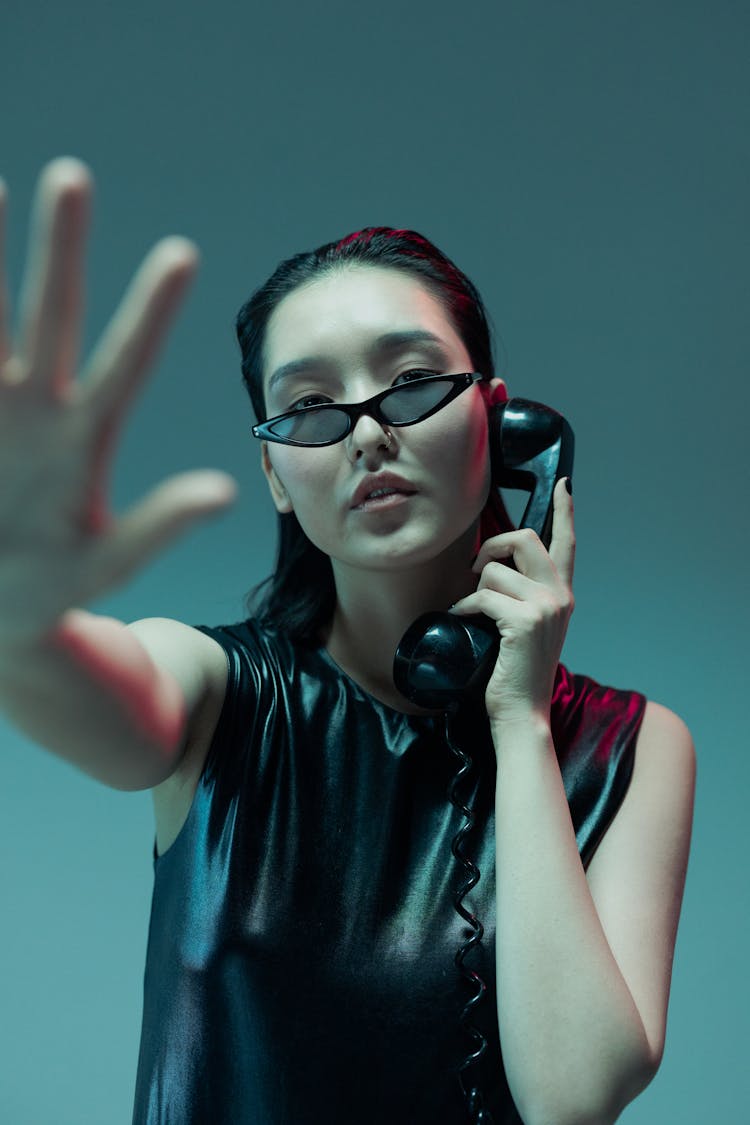 Woman Wearing Sunglasses Talking On The Phone