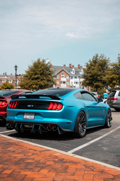 Free A Blue Ford Shelby Mustang Parked on Parking Area Stock Photo